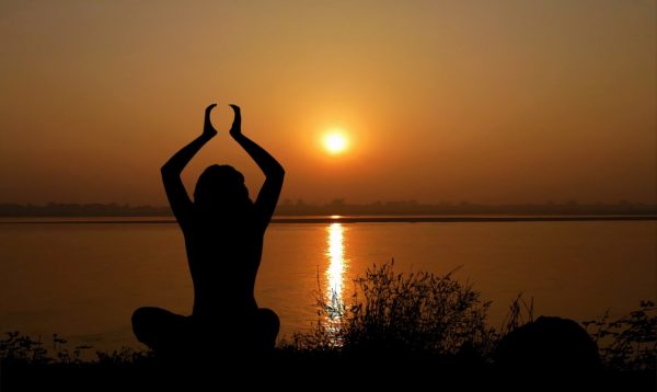 yoga pose in sunset